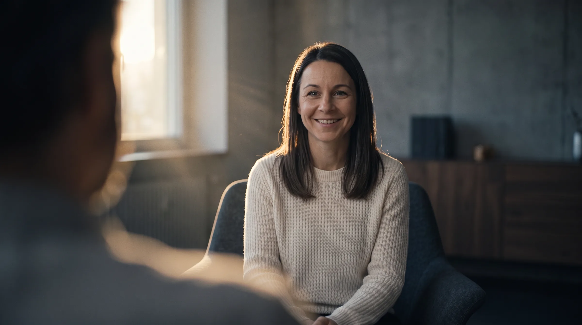 Coach lächelt in die Kamera